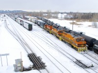 After waiting for CN 322 to backup into the yard (part of its train is visible at left where the loaded centrebeam is), SLR 394 is doing some moves before heading east to its home base of Richmond.