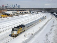 VIA 67 has wrapped F40's at each end (VIA 6416 & VIA 6420) as it passes the skyline of downtown Montreal.