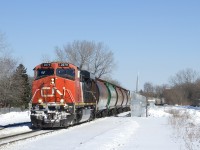 Empty grain train CN 875 has five vintage MGLX hoppers at the head end, with some new CN hoppers right behind. CN 2279 is up front and CN 3284 is mid-train, with empty potash cars behind the DPU.