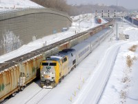 Potah train CN B730 is leaving Turcot Ouest after a crew change as VIA 67 passes with VIA 912 up front and VIA 900 shoving.