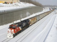 Snow-covered CN 3908 brings up the rear of potash train CN B730 as it leaves Turcot Ouest with a new crew onboard. This 205-car train has CN 3816 and CN 2917 up front and CN 3055 mid-train.