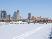 CN X306 has 113 cars and CN 5777 and CN 2008 for power as it crosses the snow-covered Lachine Canal.