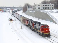 A standard cab leader is in charge of CN 324 as it heads east near Turcot Ouest, bound for Vermont. Units are CN 2012 and CN 5626.