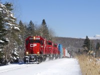 A trio of SD60 variants (CP 6232, CP 6262 & CP 6258) are working hard with a decent sized train as CP 251 climbs a grade.