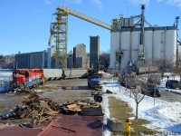 And here's the scene at the harbour as cleanup continues, Goderich Elevator & Transit company is in the background, this was the CPR side of the harbour and a loop track was situated where I am standing (existing road roughly outlines where it was) to get over to the CPR station, turntable and other facilities. I doubt engines have been seen this far since CP got rid of the line in 1988.