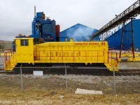 This is the last time I photographed Stelco locomotives in operation, in recent years they switched to trackmobile and the engines do not seem to be used anymore. Framed in the industrial grit of Hamilton, the yellow contrasts nicely. However, I do wish I saw this in orange. Anyone have pictures of 89 in Stelco paint? We don't seem to have one on the site. Here's a pic from <a href=http://www.railpictures.ca/author/stuart-streit target=_blank>Keith MacCauley</a> who has a number of pictures of Stelco locomotives, including <a href=http://www.railpictures.ca/?attachment_id=38758 target=_blank>this one of 92 with a couple 'goats'</a> for the pig iron blast furnace cars.