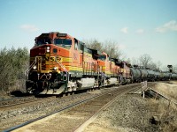 March!!  When the days get longer and it is finally tolerable to spend time at length trackside. For a while back in 2006 the CN ran trains with all kinds of odd foreign power; and quite often leaders as well. It was paradise for the fans of such.
Here is one example, this image shot as the train rolled westward over York Rd; which is the main back road into Dundas from Bayview. The time is around Noon; and BNSF 4542, 4394 and WC 7495 make this appear more like a train  photographed in the USA. But it is actually Mile 2, Dundas Sub.