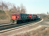 CN 3201, 9504 and 9554 power a train westbound into the long climb to Copetown. The leader, an MLW C-424, is of interest because it and 3200 were the first two of a series of C-424s to operate on CN, having been built in 1964 and the balance of the 41 units total built in 1966-67. I rarely caught either of the first two of this series leading. The 3201 was retired in 1985.