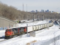 With a new crew now onboard, CN 305 is starting to pull from Turcot Ouest. Power is CN 8808 & CN 5647 up front and CN 2240 mid-train.