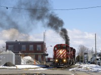 CP 251 is backing up past the out of use station at Farnham as the trailing GE smokes it up.