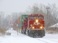 CP 112 with CP 8074 & CP 2252 up front (as well as CP 8046 mid-train and CEFX 1002 on the tail end) has just left the Vaudreuil Sub as it heads towards Lachine IMS Yard on a snowy morning.