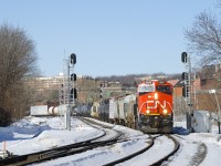 A long CN 322 is passing MP 3 of the Montreal sub; nearly at its destination of Southwark Yard. Up front is CN 3899 and mid-train is CN 2803.