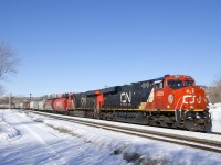 With some older hoppers up front, CN 878 is heading for the Port of Montreal with CN 3859 and CN 2851 for power. 