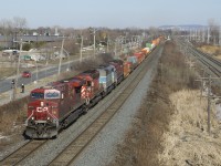 CP 143 has CP 8717, CP 6018, CMQ 9011 & CP 8548 for power as it heads west with a train of stacks and autoracks. The EMD units will be dropped at Smiths Falls to be power for a rail train.