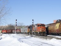 As grain train CN 878 passes at right, the Pointe St-Charles switcher is waiting for its signal so it can head west to track 29 to pick up some grain cars.