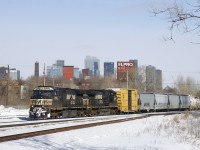 A pair of NS Dash9's (NS 9920 & NS 9646) lead a late CN 529 past the skyline of downtown Montreal. The track in the immediate foreground is the Turcot Holding Spur.