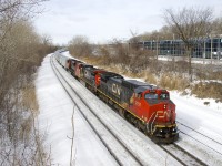 CN 874 is approaching Turcot Ouest for a crew change with CN 2151, CN 2172 & CN 8000 for power. The train consists of 99 grain cars for Bécancour, nearly all of them new CN hoppers.