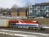 BC Rail heritage unit CN 3115 leads CN X306. It will tie down in a couple of miles and a new crew will not take it east until after dark.