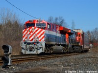 Rounding the connecting track at Clifton to the Stamford subdivision to the delight of a gaggle of photographers gathered for the moment, CN 3115 in the BC Rail "Hockey stick" inspired "CN 25" livery looks great in the morning sun, except the grime. Written in the grime is the following: "Wash me" "I feel so dirty" "Canada is better than the USA" "filthy" and a love note on the entire fuel tank. Just lovely.