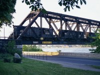 Many of you that wander down to Fort Erie to catch the early evening NS transfer know how difficult the lighting can be. Both ways.
In June of 1978 it was no different some evenings. As now, often the transfer was late. The sun here was straight down the track. I did what I thought was best, and I guess it did not work out too badly.  Here we see CR 5793, 7647 and 5788 with the daily traffic for CN. I left after this, knowing the return trip would be hopeless for photography.