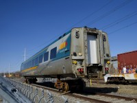 An LRC business class car is on temporary trucks as it sits in the yard at Cad Railway Industries.