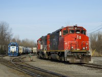 Two sets of local power rest behind the Coteau Station in the evening. At left is GMTX 2281, with CN 4721 out of sight behind it. At right are CN 9677 & GTW 6226.