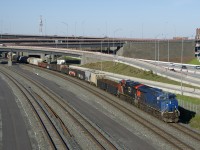 CN 321 has one of the few units on CN that are still in the blue GECX paint scheme, with most of the blue GECX units repainted into CN colours and renumbered. It is seen leading a 96-car CN 321, with CN 3185 trailing on a sunny spring evening. GECX 2029 is supposed to become CN 3121 once it is repainted and renumbered.