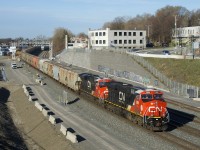 Potash train CN B730 has two tier 4 credit units with white cab roofs (CN 3899 & CN 3903) as it approaches Turcot Ouest for a crew change.