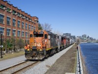 After picking up grain empties at Ardent Mills, the Pointe St-Charles Switcher is heading back to the main line with CN 4729, CN 4774, CN 9576 & CN 9523 for power. At right is the Lachine Canal and at left is a building that was once a Stelco factory.