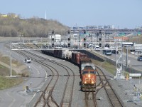 CN 5628 is all the power needed as a short CN 323 passes Turcot Ouest with 21 cars received in interchange from the NECR in St. Albans, Vermont.