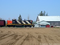 In Mennonite country, CN 1437 pauses with a short passenger train between St. Jacobs and Elmira at the Harvey H. Martin far. 1437 was donated to the Waterloo Central by CN hours earlier and this was its inaugural journey on the WCR as the crew took it for a quick spin.