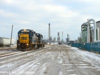 Framed in refinery, CSX Sarnia's day yard job is returning to the roundhouse with work done. In the far distance is the former Pere Marquette station and Erie & Huron roundhouse (what remains of it).<br><br>
And in other news, the motive power in Sarnia is changing after what, 20 years? It's been almost solid Gp38-2's for the longest time and today a pair of rebuilt GP40-3's arrived on the property. 6547 and 6505 are the new units so far. I don't know when i'm going to town next (it's been months for me) so hopefully you Sarnia boys can get it.