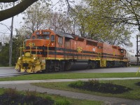 May the 4th be with me..........along with the fog and rain and whatever else dreary. But it still did not prevent me from following the old Guelph Jct Rwy; now under operation of the G&W. In this view, at a spot where  it was actually not raining, we see the Mother-daughter combo of GP40-3M 3800 and slug 800 (both lettered for the Quebec Gatineau) northbound crossing Woolwich St at Speedvale Av in downtown Guelph.  For me, something different. Good size train; maybe 15+ cars.