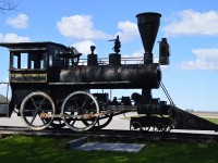 Here is a curiosity. You can make your own conclusions.  Looking up 'Alma' on google; there is a photo of this engine, referring to it as a "historic steam engine on display near the old Alma Station".
But it appears this is a non-operable replica of sorts. If so, whoever constructed this did a remarkable job.
Old gauges inside, iron firebox door; whistle, bell and lamp all look real, but the pilot is wooden. Huh? And why would it be lettered for the Lacombe and Northwestern, which is a long gone road out in Alberta? Certainly is worth checking out if you are ever in the area. Personally, I thought it was built for use in an amusement park or something of that sort. And this remarkable "replica" appears to be built more than 60-70 years ago.
Very close by, the old GTR turned CN line went thru. 
The line was removed around 1970. Not known when the station came down.