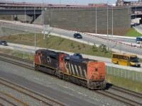 A cowl is leading long hood forward as CN 585 heads from Southwark Yard to Taschereau Yard light power with CN 2423 & CN 8020. They will wye a unit and pick up their train there before heading to Brockville.