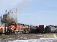 CP 6018 & CP 7011 are the power on CP 251 as it backs into Farnham Yard. In the background at left is the Robitaille feedmill.