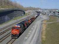 CN 3248 & CN 3898 lead a 112-car CN 321 by Turcot Ouest. Both units feature white cab roofs, a feature found on CN's most recent GEVO's.