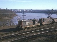 Rather rough old image. GT 4428 and 4427, a pair of early GP9s; already 20 years old when this photo was taken, power a ballast train eastward toward Aldershot from Hamilton. The locos were previously numbered 1752 and 1751.