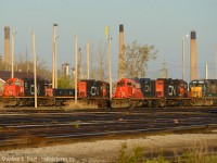 The kind of warm golden light you only find at 0630.<br><br>
Power at the Bunkhouse in Sarnia in C yard - a pair of CN yard sets and CSXT 2561 which was being worked on by LDS to support CSX's Sarnia operations. LDS does 92 day inspections of CSX units and light work to avoid sending them back to the US, which occasionally allows one to be seen parked here waiting to go in or out.