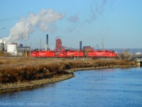 With steel mills busy in the background, CP's TH11 is working the customers on the far east side of the shared track in the Port of Hamilton on a very fine November morning.