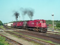 Another great morning at Guelph Jct., this day turned out to be.  Alcos behaving like Alcos. Accelerating out of the Junction eastward under smoke. The sights and the sounds will be with me forever. It was worth the drive from St. Catharines, where I lived at the time, to see a show like this; and I made it as often as I could. CP 4709, 4738 and 4720. Three M-636s. Perfect!!
I'm sorry that todays GEs do not do much for me. Spoiled, I guess.
Image shot using Mamiya 645 1000-S medium format camera, 400 ISO Kodak film, 500 F5.6; 90 MM fixed lens; for those who are interested.