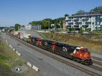 A 602-axle long CN 120 has CN 3906, CN 3030 & CN 3136 up front (and no DPU) as it heads east.