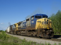 A pair of reactivated Dash8-40CW's in the YN2 paint scheme (CSXT 7894 & CSXT 7864) are the power on a 12-car CSXT B763 as it departs Beauharnois, bound for Massena. I got lucky here, with the conductor walking up to the head end as I arrived and the train departing a minute later.