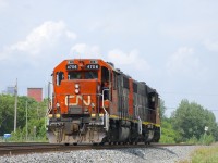 After bringing a single boxcar to the Kruger plant, CN 4706 & CN 4707 are leaving the Turcot Holding Spur light power. Having already received permission from the RTC to enter the south track of CN's Montreal Sub at MP 3.85, the power is heading east with the conductor in place to throw the switch once the power has passed him.