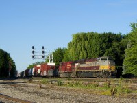 It's early in the morning as heritage unit CP 7012 (along with CP 8923) powers a short CP 253 off the St. Lawrence River bridge and past the partly torn up Lasalle Yard.