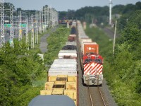 BC Rail heritage unit CN 3115 is leading CN 120 as it passes CN 305 in Beaconsfield. Ironically I passed CN 529 with NS 8103 (N&W heritage unit) leading while en route to get this shot. Unfortunately the power was swapped at Taschereau Yard, so this unit will not be leading CN 120 into Halifax tomorrow morning.