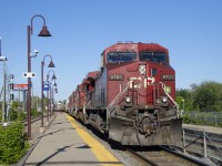 CP 119 has five GE units up front (CP 9701, CP 8532, CP 9765 CP 8551 & CP 8056) as it sits stopped at Lachine Station before backing up and lifting cars at the Lachine IMS Yard.