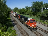 CN 120 has CN 3282 & CN 3158 up front (and CN 2885 mid-train) as it heads east after departing Taschereau Yard. CN 3115 (the BC Rail heritage unit) had led CN 120 inbound into Taschereau earlier this morning, but unfortunately the power was swapped out in the yard.