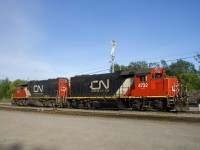 A pair of clean GP38-2's (CN 4732 & CN 4715) lay over at Coteau on a warm spring evening.