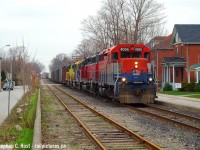 With a departure from Kitchener after meeting 85, eastbound 432 was best photographed on a cloudy day around Guelph. So here's one of my many offerings along Kent St, this one posted to contrast <a href=http://www.railpictures.ca/?attachment_id=45732 target=_blank>this recently posted CN view of mine</a> of the 'new' CN era. The four axle era on GEXR sure was sweet.I wonder what this will  look like once Metrolinx puts back the siding that was removed.. which I'm told is coming soon.. very soon. (I'll believe it when it happens).<br><br>
See the house for sale? I bet that sold in 2006 for about $250k.... dreams now.